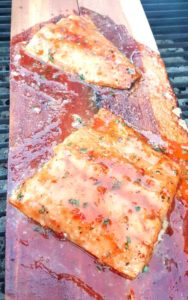 Grilled Salmon with Sweet Chili Glaze - Sweet and spicy. Light and savory. This Grilled Salmon with Sweet Chili Glaze is a perfect example of mixing flavors together, and having them work together perfectly.