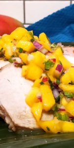A tasty Jamaican Pork Tenderloin with Mango Habanero Salsa that is a blend of flavors that are exquisite, fiery, cool, sweet, and spicy...or in just two words, pure goodness!