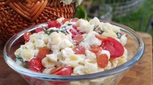 Fresh tomato and basil come together with a few other ingredients to make a simple pasta salad with a huge depth of flavor.