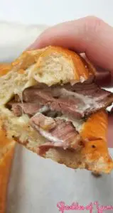 Slow wood smoked brisket on a cheesy garlic bread. You are going to fall in love with this sandwich.