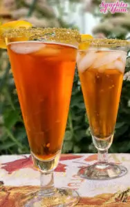 Deliciously simple Hocus Pocus Aperol Fizz with no food coloring only 3 ingredients make this beautiful drink and a little gold sugar is all you need!