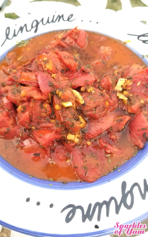 This Chicken with Herb Roasted Tomatoes Over Ravioli came out tasting fabulous, with a scrumptious pan sauce. It looks pretty fancy as well, but it couldn't be easier