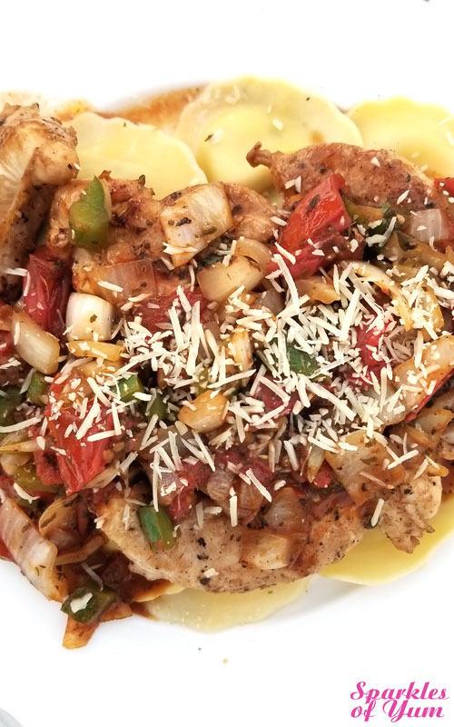 This Chicken with Herb Roasted Tomatoes Over Ravioli came out tasting fabulous, with a scrumptious pan sauce. It looks pretty fancy as well, but it couldn't be easier