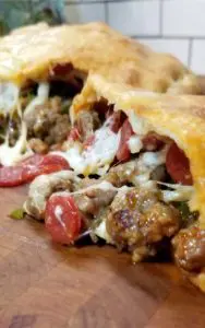 This Meat Lovers Gameday Calzone has all the fixings of a supreme pizza in Calzone form. Fun to make and even more fun to eat! Perfect for a Super Bowl party or any gameday!