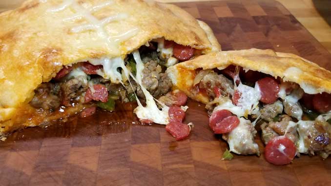 This Meat Lovers Gameday Calzone has all the fixings of a cheesy supreme pizza in a Football Calzone form. Fun to make and even more fun to eat! Perfect for a Super Bowl party or any gameday!