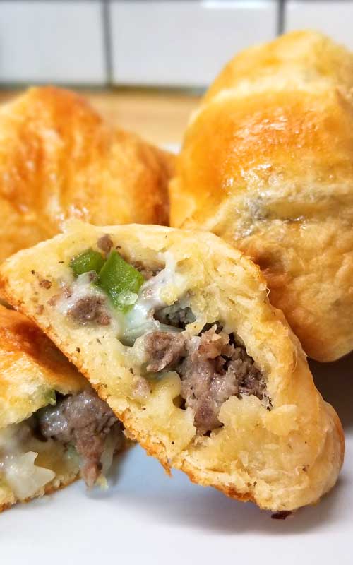 Want something easy and tasty? These little Philly Cheesesteak Party Bites are so yummy. Rolled up little crescent roll pockets filled with cheesy, meaty, and the flaky goodness! These would be great for any special event, from baby showers to birthday parties.