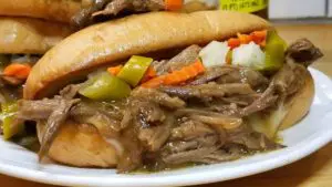 Slathered with luscious garlic butter, ooey-gooey provolone cheese, a bit of tang from the giardiniera, and the rich flavors of the roast beef. THIS is one of my all time favorite sandwiches!
