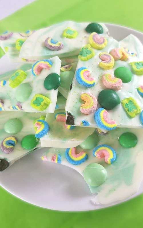 Lucky Charms Minty Rainbow Bark Recipe - In need of a fun and simple treat? One that's not gonna cost a small fortune to make? My Lucky Charms Minty Rainbow Bark has you covered. This literally only takes a few minutes to make.