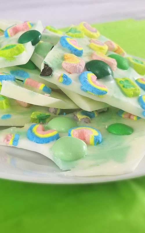 Lucky Charms Minty Rainbow Bark Recipe - In need of a fun and simple treat? One that's not gonna cost a small fortune to make? My Lucky Charms Minty Rainbow Bark has you covered. This literally only takes a few minutes to make.