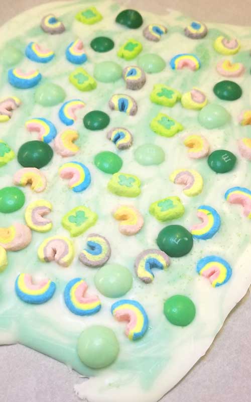 Lucky Charms Minty Rainbow Bark Recipe - In need of a fun and simple treat? One that's not gonna cost a small fortune to make? My Lucky Charms Minty Rainbow Bark has you covered. This literally only takes a few minutes to make.