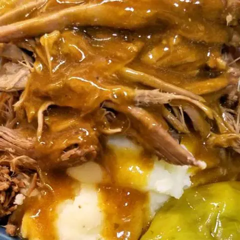 An easy peasy gravy makes a silky, scrumptious, and divine addition to this fork tender Mississippi Pot Roast recipe that broke the internet. Hits it out of the park every time! A few squeezes with the tongs, and this roast literally falls apart.