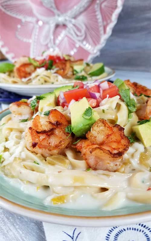 This is a simple, flavorful creation that's ready to party on your plate! Creamy cheesy sauce, buttery shrimp, and Pico De Gallo all make this Creamy Mexican Shrimp Pasta Recipe a love fest for your taste buds!