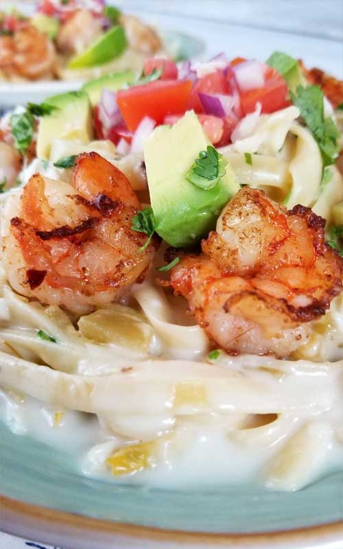 This is a simple, flavorful creation that's ready to party on your plate! Creamy cheesy sauce, buttery shrimp, and Pico De Gallo all make this Creamy Mexican Shrimp Pasta Recipe a love fest for your taste buds!