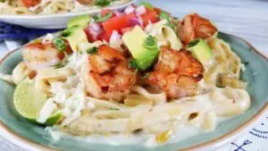 This is a simple, flavorful creation that's ready to party on your plate! Creamy cheesy sauce, buttery shrimp, and Pico De Gallo all make this Creamy Mexican Shrimp Pasta Recipe a love fest for your taste buds!
