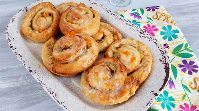 Jazz up your morning with some sweetness. Quick and simple Orange Pineapple Sweet Rolls with a Pineapple Glaze!