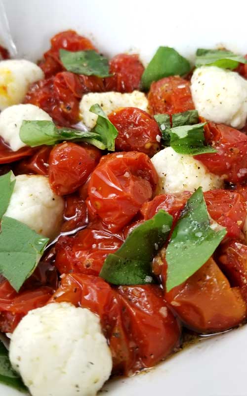 Roasted Tomato Caprese Salad Recipe - A truly delicious little salad to go with just about anything, something a little different. It only looks like you splurged, when in reality it couldn't be more budget friendly, or easy.