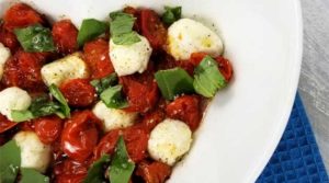 Roasted Tomato Caprese Salad Recipe - A truly delicious little salad to go with just about anything, something a little different. It only looks like you splurged, when in reality it couldn't be more budget friendly, or easy.