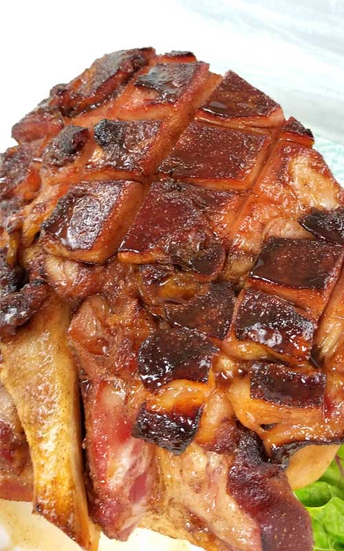 TA DA!! Between the deep, smoky, sweet flavors from the bourbon to the fragrance of the warm spices caramelizing on the ham; it's hard not to pick pieces off of this Southern Honey Bourbon Glazed Ham before it's ready to hit the table.