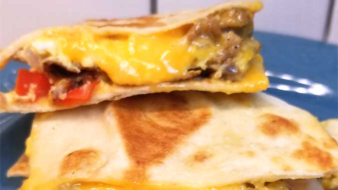 Simple quick easy cheesy, a little bit crispy, and always yummy Breakfast Quesadillas are a nice change of pace for the breakfast table. Well I think they'd be good at lunch or dinner too!