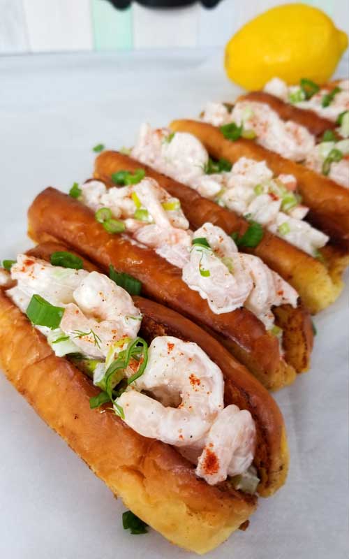 Sweet shrimp slathered in a lemon dill mayo sauce, all jammed into a potato roll. It's like taking your taste buds on a trip to a New England beach, all without leaving town. 