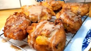 When fresh peaches are at the farmers market, and it's too damn hot to turn the oven on, you make Peach Fritters with Honey Cinnamon Glaze! And they are so good, you can't even come up with words for how good they are.