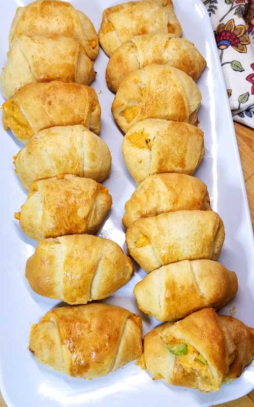 If your a fan of Buffalo Chicken, your going to fall in love with these little Beer Cheese Buffalo Bites wrapped in warm buttery crescent rolls perfect for football munching or TV binging.