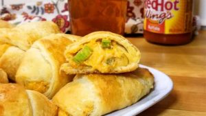 If your a fan of Buffalo Chicken, your going to fall in love with these little Beer Cheese Buffalo Bites wrapped in warm buttery crescent rolls!
