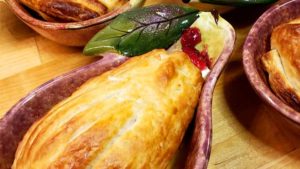 Impress your guests with a beautiful puff pastry dressed pear nestled in with warm brie and cranberry sauce. These Pastry Wrapped Pears with Cranberries and Brie are a delicious easy dessert anyone can make and it only takes a few minutes!