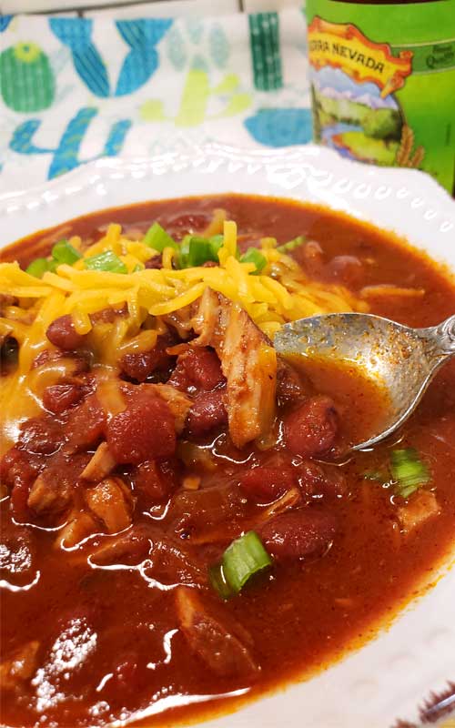 Sweet meets heat in this hearty Kansas City Style Pulled Pork Chili. Be sure to grab a cold brewsky because one's going in the pot to add to the complex flavors of this Midwestern favorite!