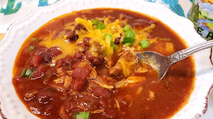 Sweet meets heat in this hearty Kansas City Style Pulled Pork Chili. Be sure to grab a cold brewsky because one's going in the pot to add to the complex flavors of this Midwestern favorite!