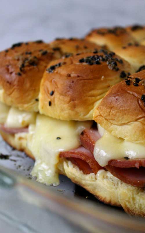 Sink your teeth into these Ham and Cheese Sliders and you won't be able to stop at one. They are so good, you'll want them at every party!