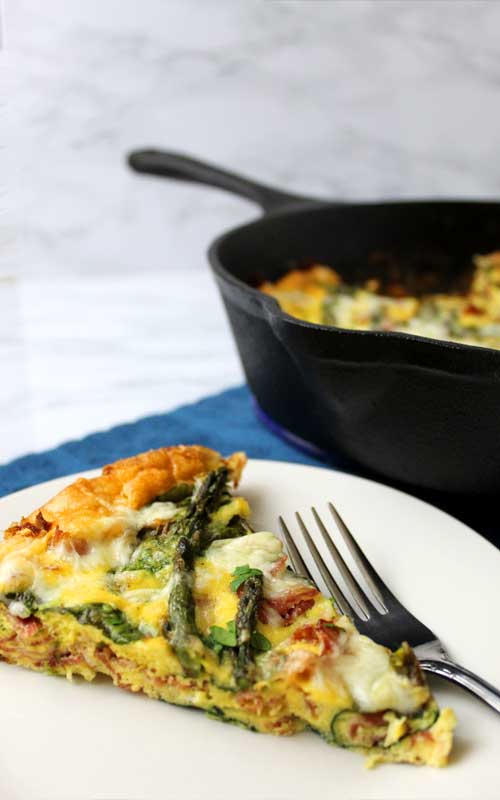 Looking for an awesome brunch recipe? Not only is this Asparagus and Prosciutto Frittata delicious. It is also quick, easy, and fun to make.