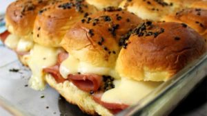 Sink your teeth into these Ham and Cheese Sliders and you won't be able to stop at one. They are so good, you'll want them at every party!