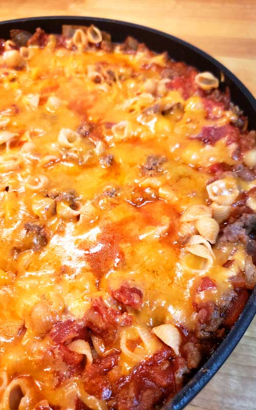 Need a great everyday meal that tastes delicious? Well, I've got you covered with this Cheesy Hamburger Skillet! It's my homemade version of Hamburger Helper, only better because you control what goes in it. #dinnerideas #hamburger #pasta #easyrecipe