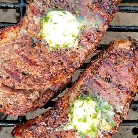 Grilled Rib-Eye Steaks with Roasted Garlic Herb Butter