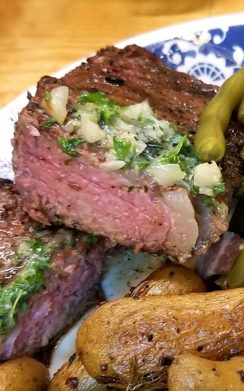 Grilled Rib-Eye Steaks with Roasted Garlic Herb Butter - Sparkles of Yum