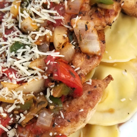 Chicken with Herb Roasted Tomatoes Over Ravioli