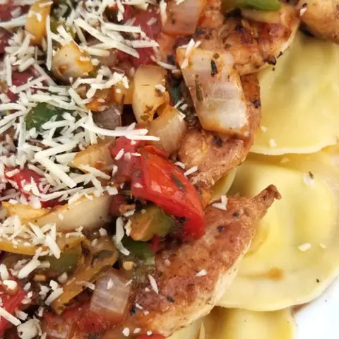 Chicken with Herb Roasted Tomatoes Over Ravioli