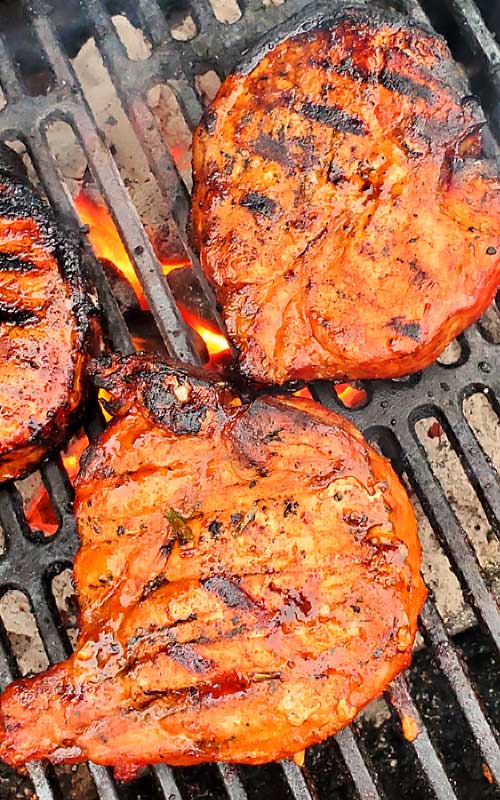 These Korean BBQ Pork Chops are packed with with a little sweet, a little heat, and a lot of juicy. A ton of smoky flavor and super tender. These are among some of the best pork chops we have ever ate! #grilling #porkchops #Korean #dinnerideas