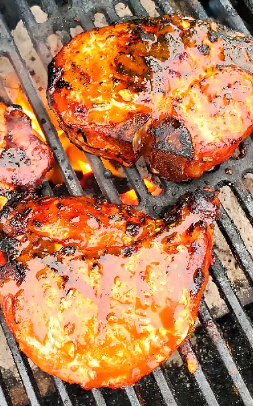 These Korean BBQ Pork Chops are packed with with a little sweet, a little heat, and a lot of juicy. A ton of smoky flavor and super tender. These are among some of the best pork chops we have ever ate! #grilling #porkchops #Korean #dinnerideas