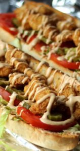 The Shrimp Po Boy is the king of New Orleans sandwiches! French bread spilling over with shrimp, lettuce, tomato, and a homemade rémoulade sauce.